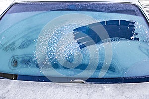 Cleared the frost on the windshield in the cold, front and rear blurring the background