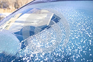 Cleared the frost on the windshield in the cold, front and rear blurring the background