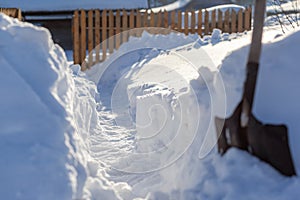 Clearing snow after a big snowfall in winter.