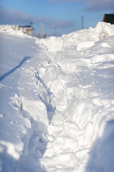 Clearing snow after a big snowfall in winter.