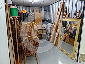 Clearing a storage unit full with household furniture photo