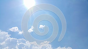 Clearly visible lines of white clouds and blue sky, the top is the sunbeam, copy space for text