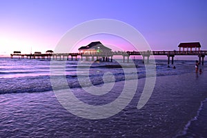 Panoramic view of Pier 60 on magenta sunset background at Cleawater Beach.