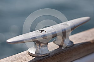 Cleat, stainless steal. Sailors world, sailing boat equipment. Important nautical details. Safety on board.