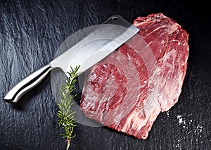 Cleaver with a lean raw shank steak