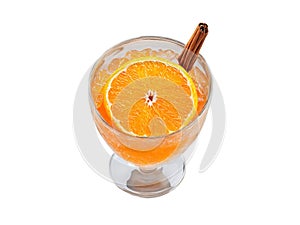 Clementine soda in a bell shaped glass clementine segments and cinnamon sticks vibrant orange splash photo