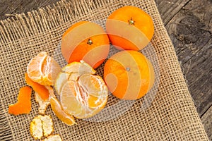 Clementines on a jute base with a wooden table