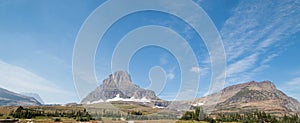 CLEMENTS MOUNTAIN ON LOGAN PASS UNDER CIRRUS CLOUDS DURING THE 2017 FALL FIRES IN GLACIER NATIONAL PARK IN MONTANA USA