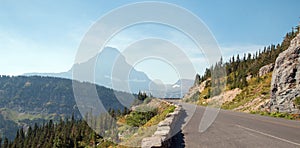 CLEMENTS MOUNTAIN AT THE TOP OF LOGAN PASS ON THE GOING TO THE SUN HIGHWAY UNDER CIRRUS CLOUDS IN GLACIER NATIONAL PARK USA