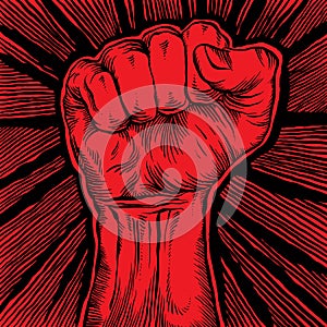 Clenched fist held high in protest.