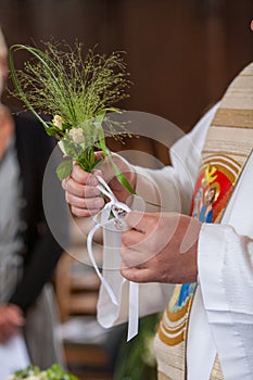 Clerical Benediction with Floral Sprig