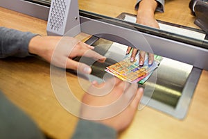 Clerk giving cash money to customer at bank office