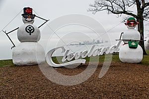 Cleveland Sign and Giant Snowmen - Foggy Lake Erie - Cleveland, Ohio Skyline