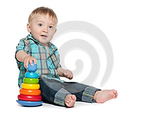 Clever baby boy with toys