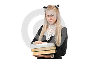 Clever blonde girl with glasses and pile of books