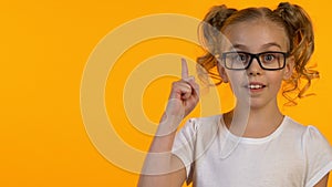 Clever female kid in glasses having idea, knowledge curiosity, template, closeup