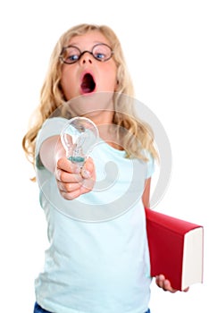 Clever girl with light bulb and book