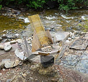 A clever home-made sluice set up beside a river in alaska