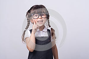 Clever kid in glasses and school uniform. Genius child. Kids and great idea. Tidy hairstyle.