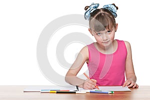 Clever schoolgirl at the desk