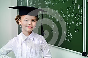 Clever smiling schoolgirl