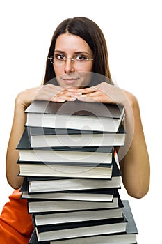 Clever woman student on pile of books