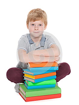 Clever young boy with books