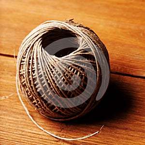 Clew of pack-thread on wood board