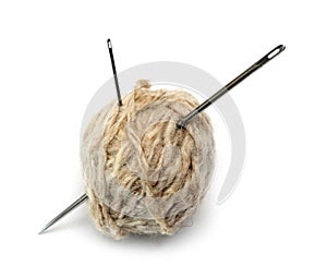 Clew of wool thread and two needles