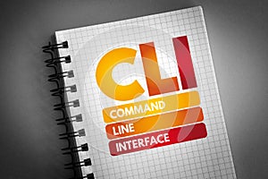 CLI - Command Line Interface acronym on notepad, technology concept background