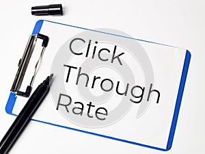 Click through rate concept written on paper clipboard.