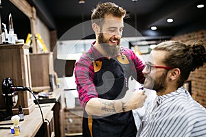 Client during beard and moustache grooming in barber shop