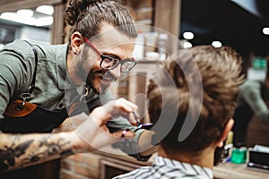 Client during beard and moustache grooming in barber shop