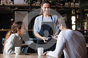 Client in cafe paying using mobile application NFC payment