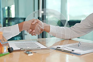 Client shaking hands to realtor mortgage insurance broker lawyer. customer handshaking with financial advisor for advice, making