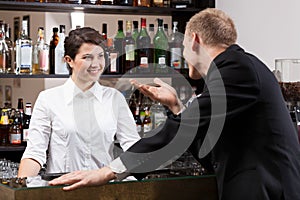 Client talking with girl bar