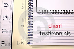 Client testimonials text concept on notebook