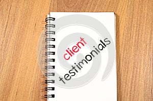 Client testimonials text concept on notebook
