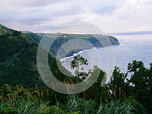 Cliff of Algarvia seen from the miradouro Despe-te-que-Suas on the island of Sao Miguel photo