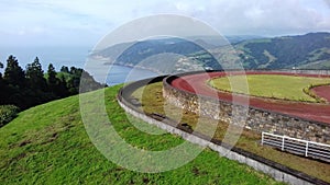 Cliff on the Atlantic ocean seen from the miradouro do Pico Longo in Azores photo