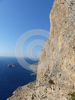 Cliff on a blue sea to Amorgos in Greece.