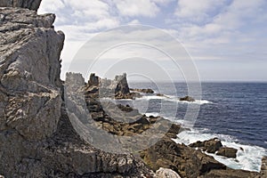 Cliff by the coast over the sea