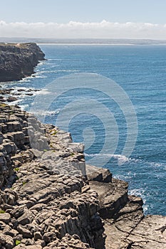 Cliff in the coastline with blue sea