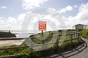 Cliff edge please keep to footpath sign