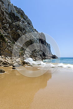 Cliff and empty beach in the Beliche beach, Sagres, Portugal photo