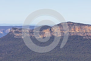 A cliff face in Jamison Valley in The Blue Mountains in Australia photo