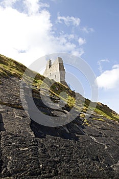 Cliff face view of castle ruins