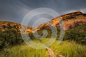 Cliff faces glow red in the golden gate highlands national park, lit up by the setting sun