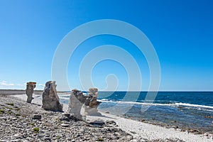 Cliff formations at the rocky coast of Gotland, Sweden photo