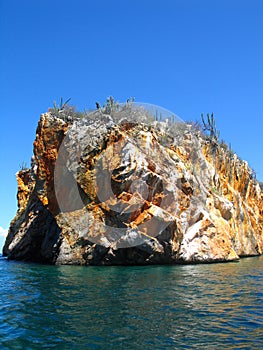 Cliff inside the deep blue of Caribbean sea Venezuela photo